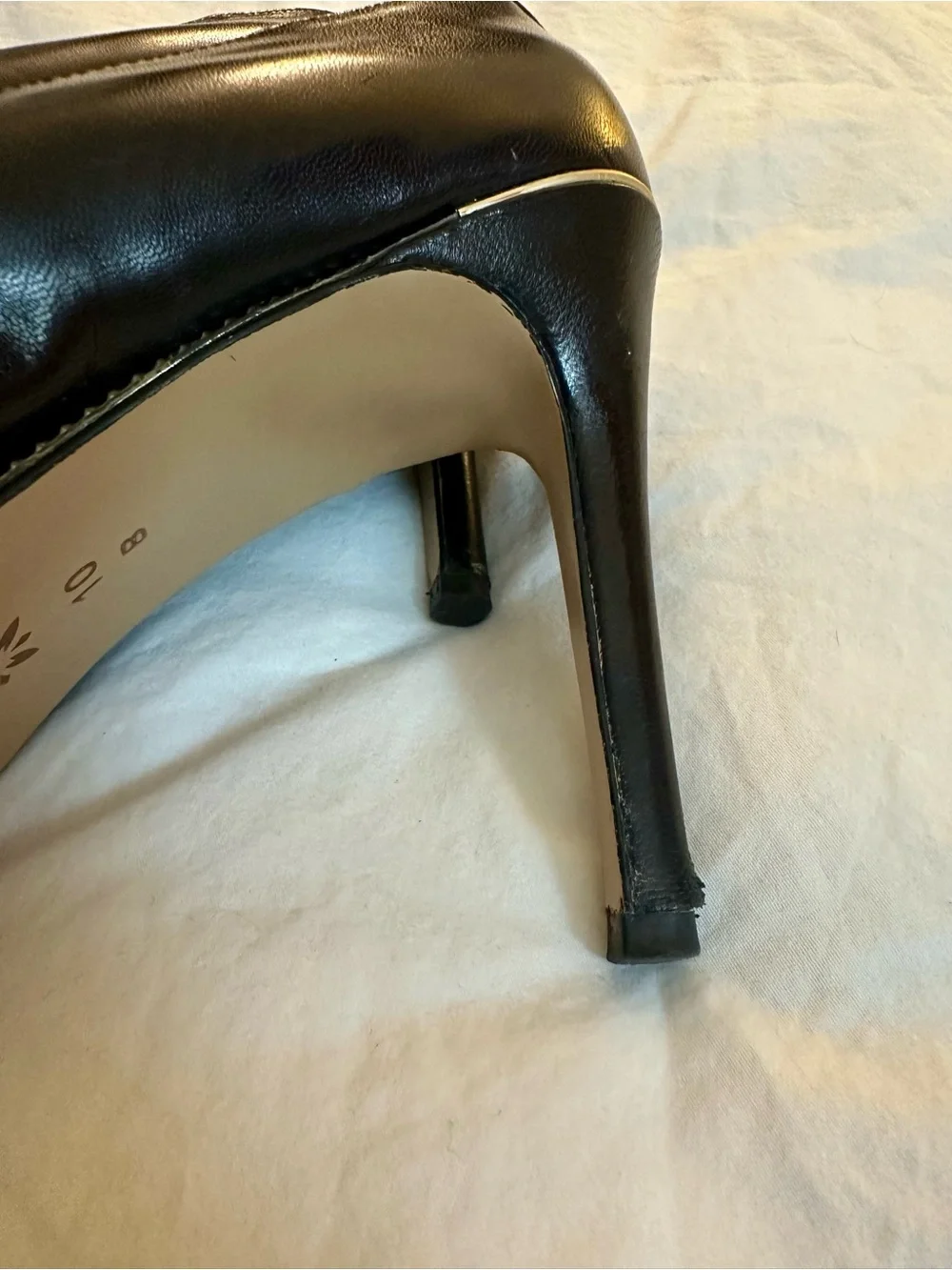 BCBGeneration Black Pointed Toe Pumps with Gold Trim